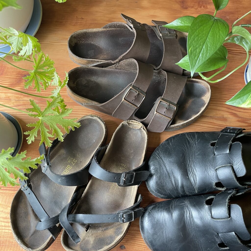 three pairs of birkenstocks